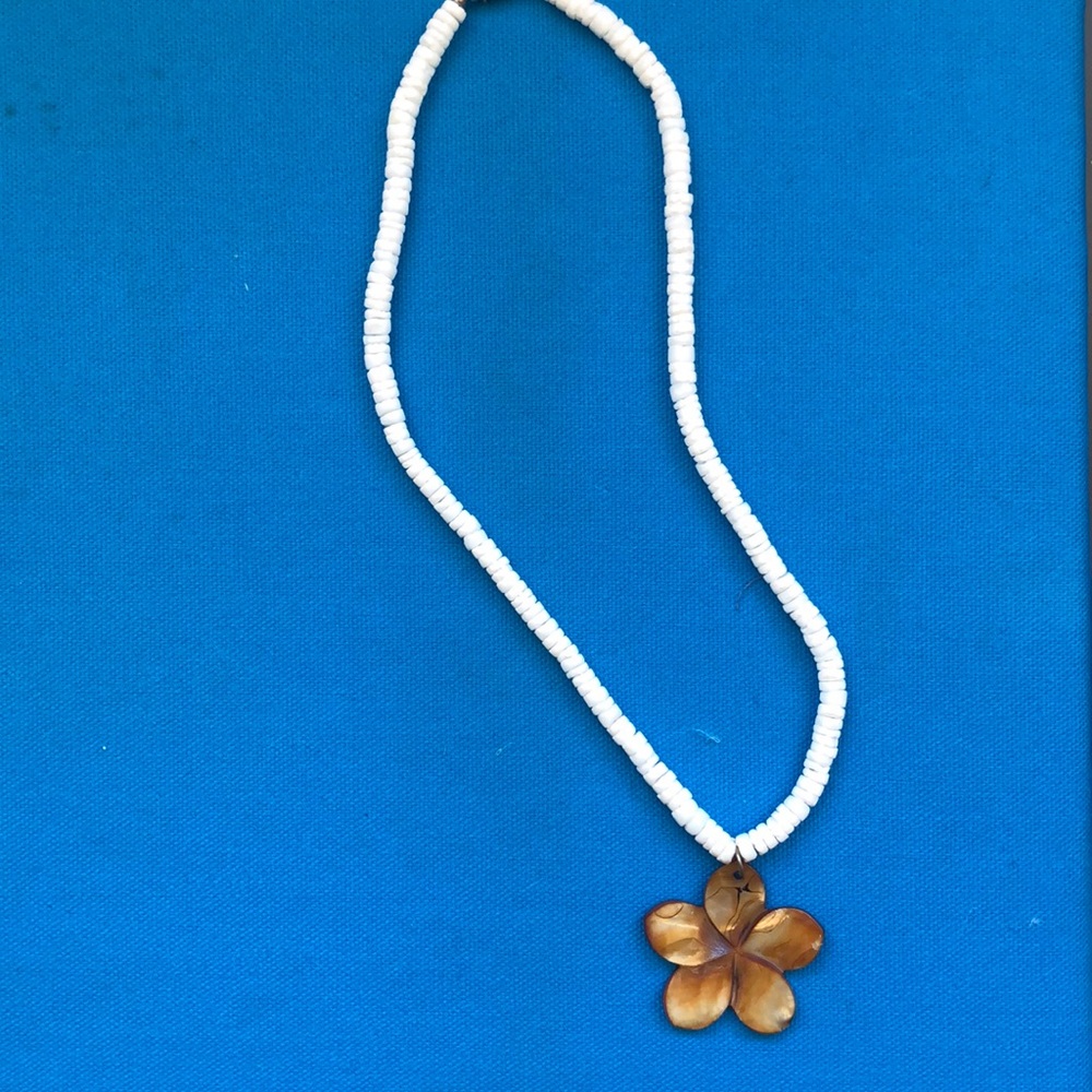 puka shell necklace with shell flower